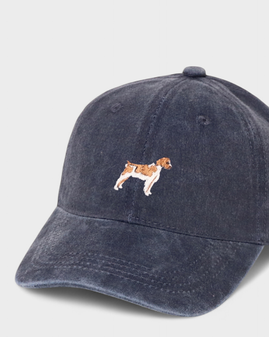 Brittany Spaniel personalised embroidered hat in navy blue washed cotton.