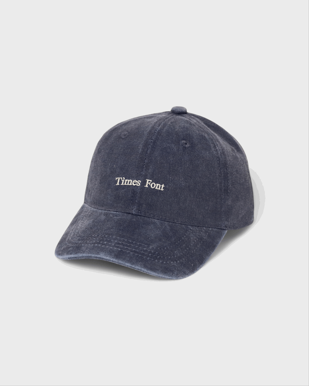 Personalised navy blue cap with white text embroidery, made of 100% washed cotton in a classic baseball fit.