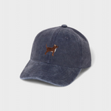 Navy blue washed cotton baseball hat with embroidered small brown and white dog design on front, personalized embroidery available on back