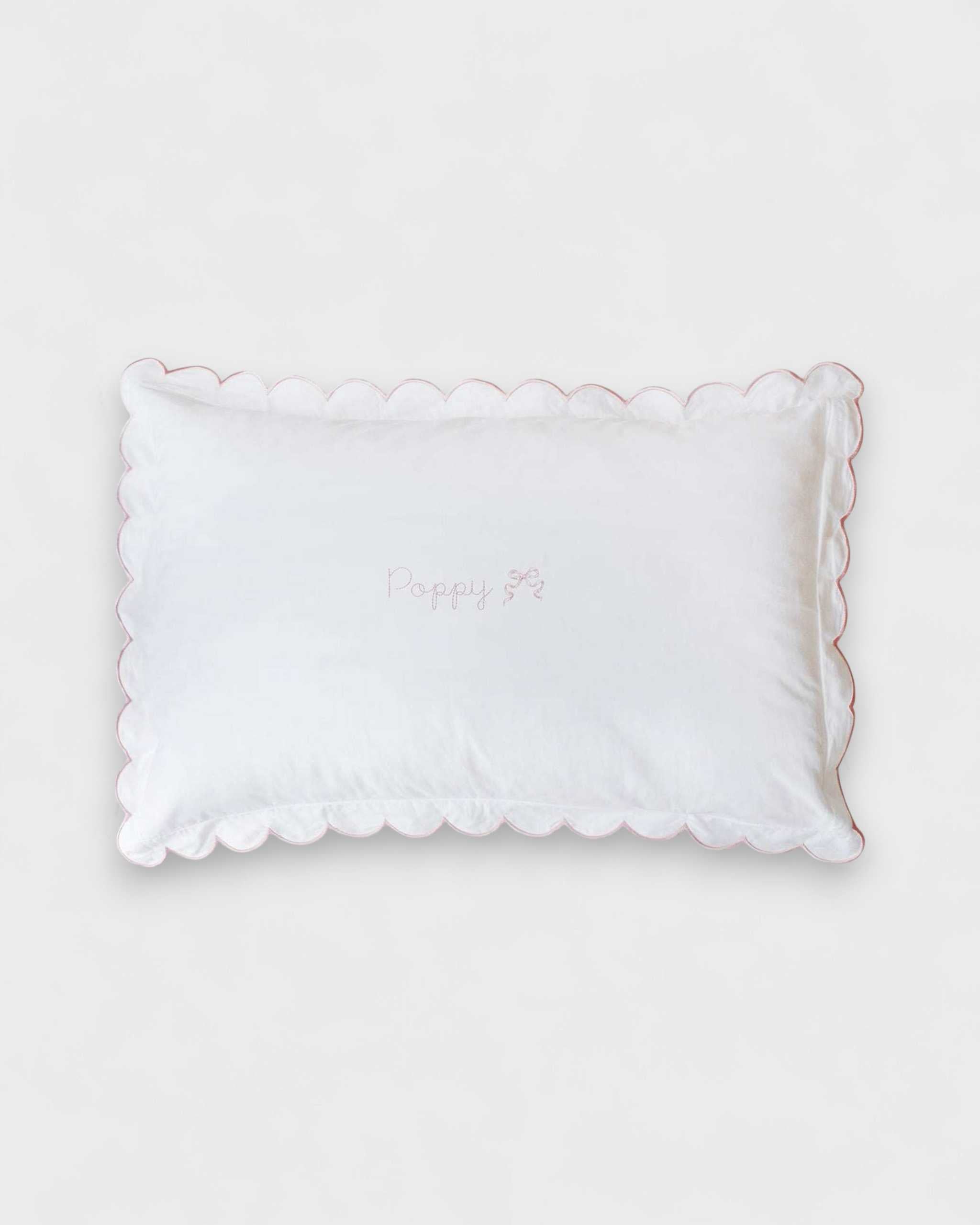 Toddler pillowcase with blush scalloped edge in organic cotton.