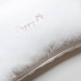 Organic cotton toddler pillowcase with blush scalloped edge and personalized embroidery.