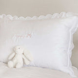 Organic cotton pillowcase with white scalloped edge and customizable embroidery.