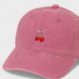 Pink personalised hat with embroidered cherries and pink bow, made of 100% washed cotton.