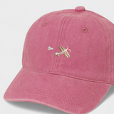 Airplane personalised hat with embroidered design on the front in pink color, made of 100% washed cotton.