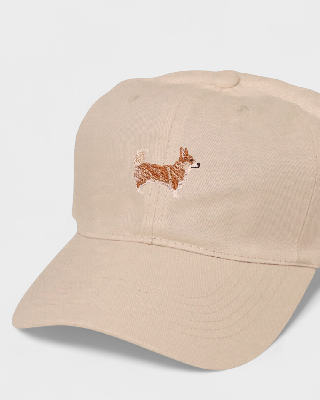 Corgi Personalised Hat with embroidered Corgi design on beige cotton baseball cap.