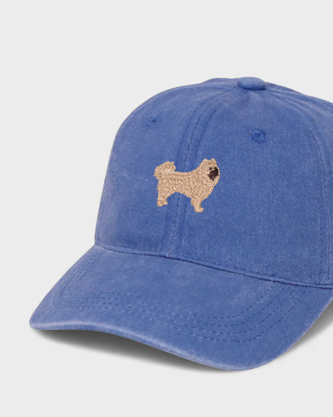 Husky personalised hat with hand-drawn Chow Chow embroidery on blue cotton fabric.