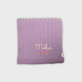 Purple merino baby blanket with rosette cross stitch embroidery and personalized name Mika