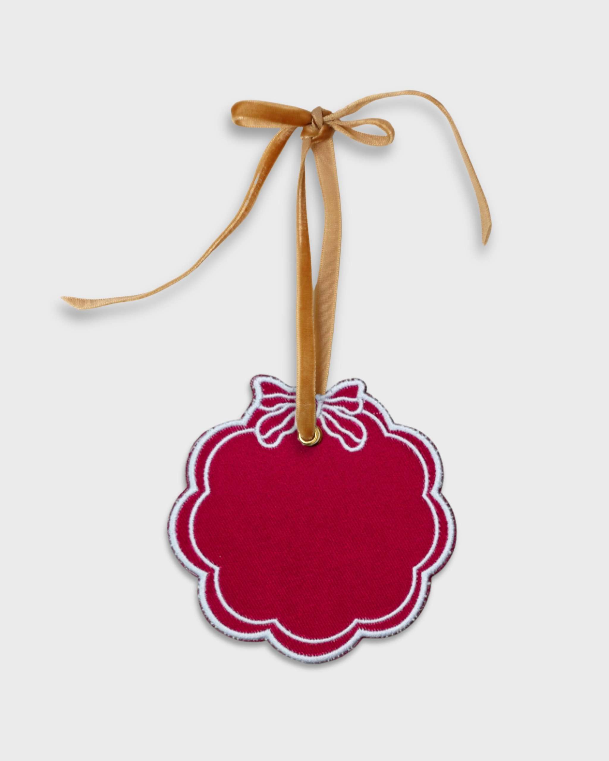 Red scalloped personalised pet ornament with embroidered bow and gold velvet hanging ribbon