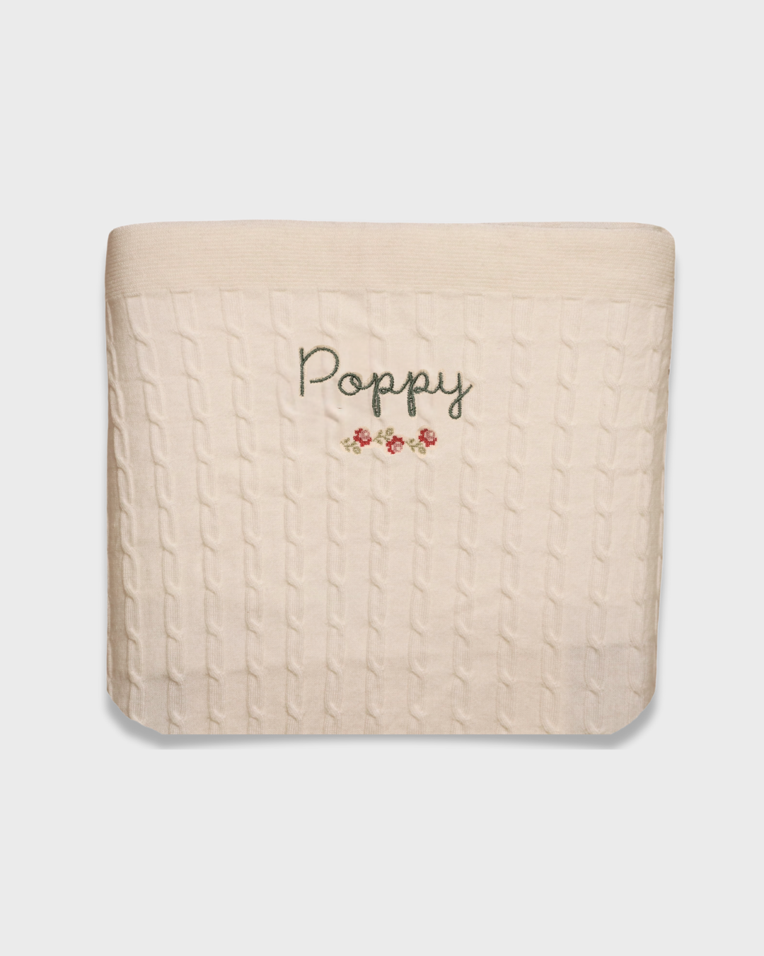 Merino baby blanket with rosette embroidery, personalized design.