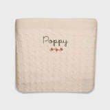 Merino baby blanket with rosette embroidery, personalized design.