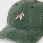 Green Schnauzer personalised hat with embroidered dog design on front, made of 100% washed cotton in classic baseball style.