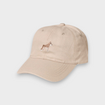Beige Schnauzer personalised hat with embroidered dog design on front and custom embroidery on back, made of 100% washed cotton.