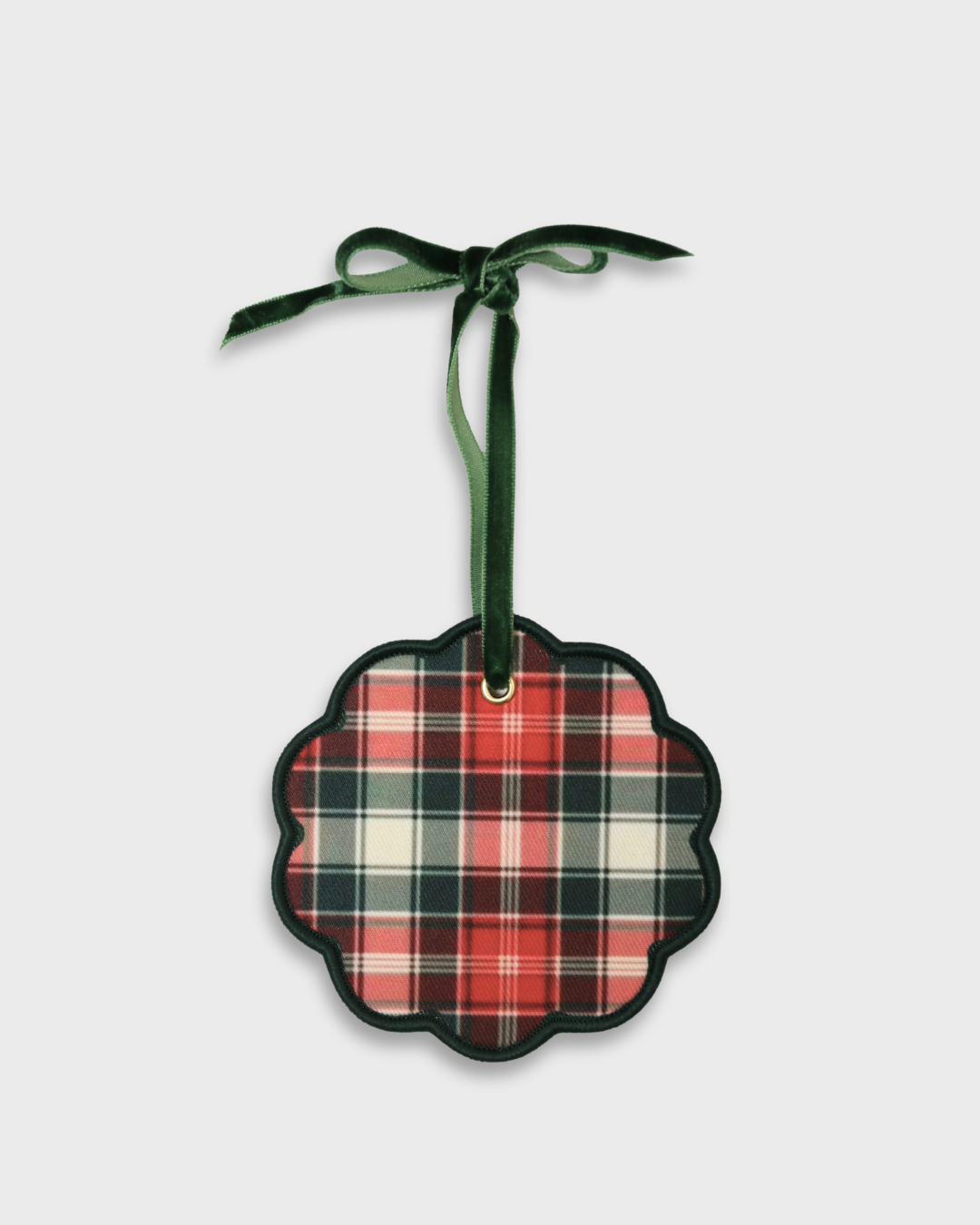Personalised pet ornament with red and green tartan pattern and green velvet ribbon for hanging