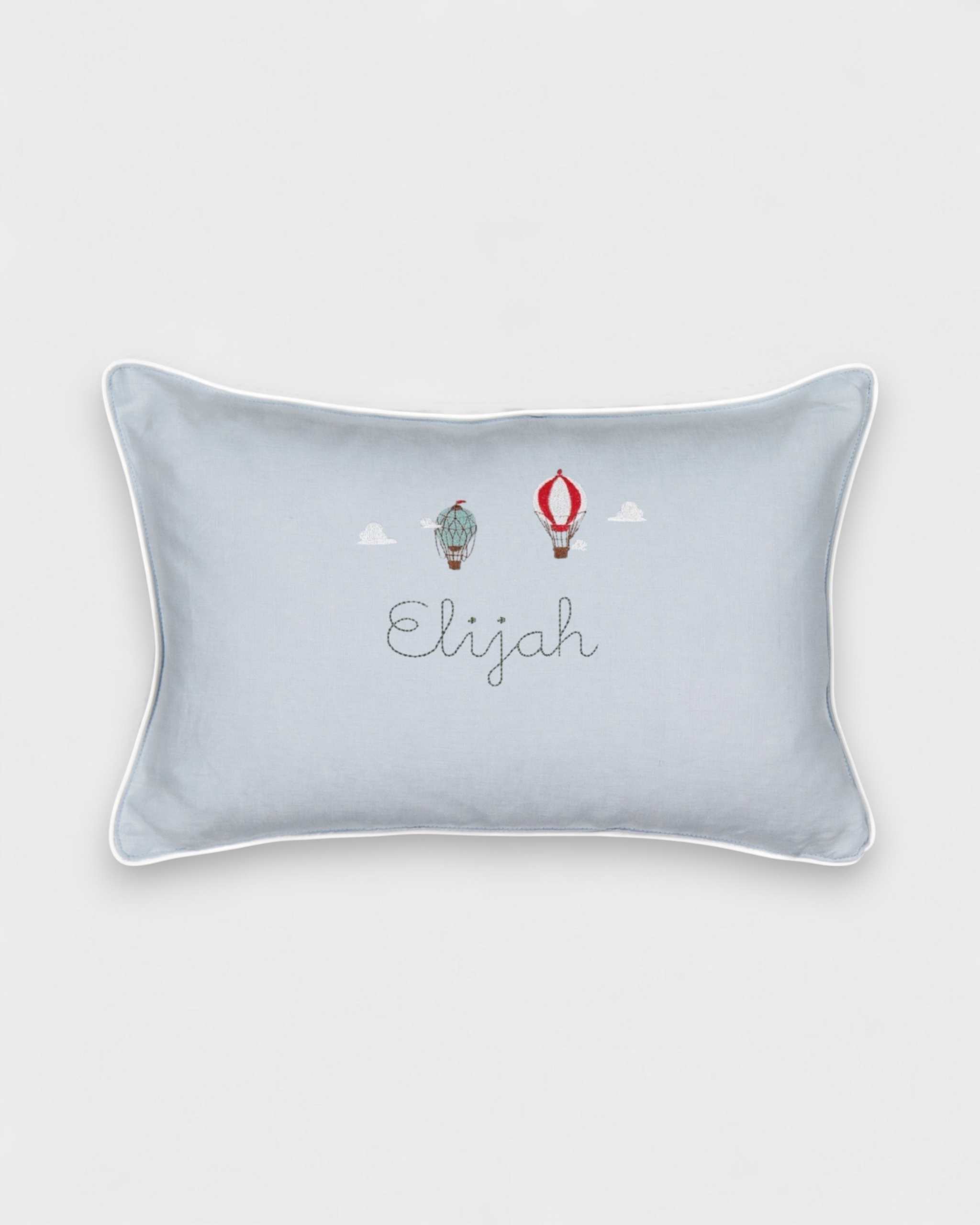 Cushion in duck egg blue linen with vintage hot air balloon embroidery.