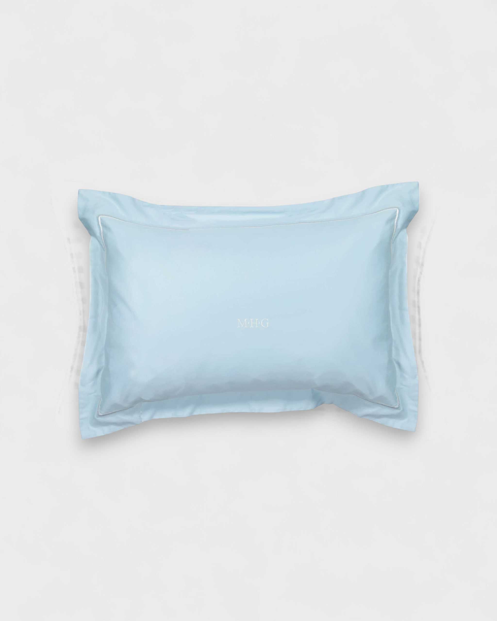 Toddler pillowcase blue with embroidered flange edge and customizable design.