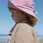 Customised pink bucket hat for kids made of 100% washed cotton.
