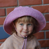 Customised pink bucket hat for kids made of 100% washed cotton.