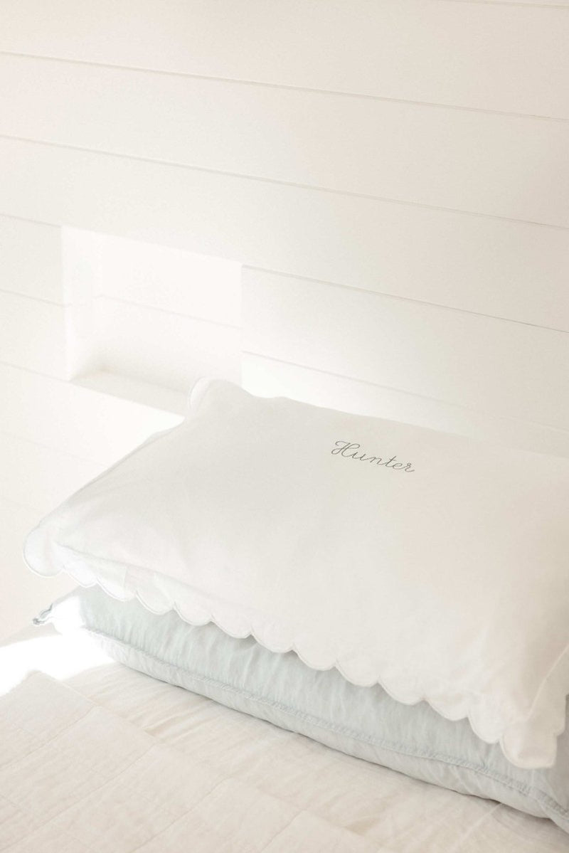 Embroidered pillowcase on bed